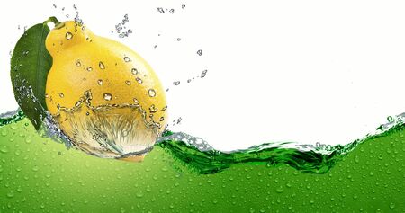 Ripe citrus lemon,amid a spray of juice.の写真素材