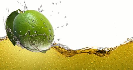 Ripe citrus lemon lime,amid a spray of juice.の写真素材