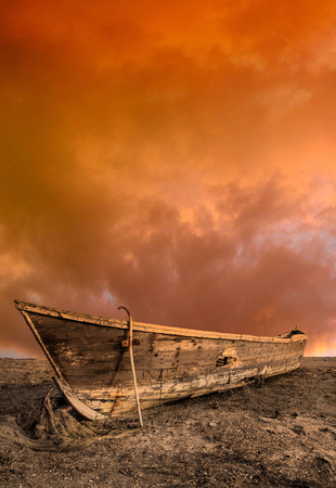 Fishing boat on the background of the evening sunset.の写真素材
