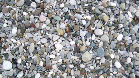 The texture of sea and river pebbles, background image.の写真素材