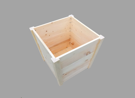 Empty wooden box on isolated gray backgroundの写真素材