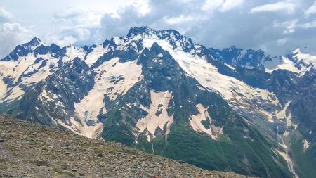 Mountain, summer landscape on the background of snowy peaksの写真素材