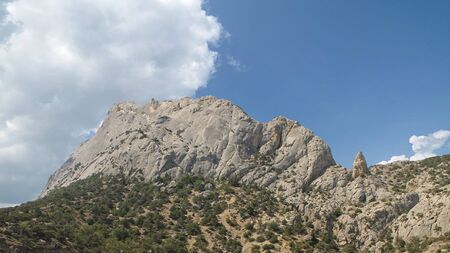 Mountain summer landscape with cloudy sky and mountain topの写真素材