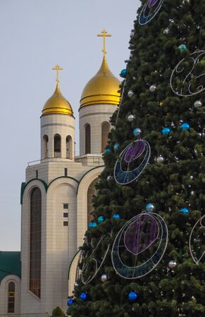 Christian temple in Kaliningrad, against the background of the New Year tree. Photographed in December 2019.の写真素材