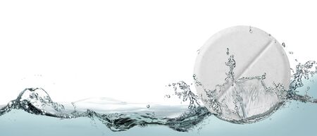 White medical tablet in spray of water.の写真素材