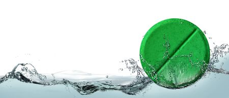 Green pill with dietary supplement for weight loss.の写真素材