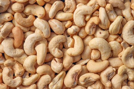 Peeled and dried cashew nuts. Background, food.の写真素材
