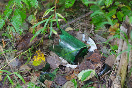 Broken glass, bottles thrown by people. Environmental pollution.の写真素材