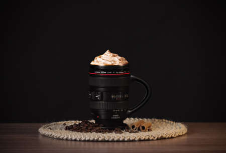 A mug of coffee in the image of a Canon lens.の写真素材