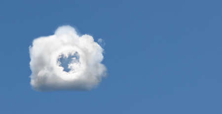 Cloud in the form of a camera in the blue summer sky.の写真素材