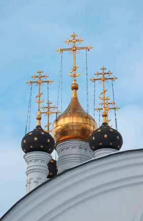 Domes of an Orthodox Christian church with gold crosses.の写真素材