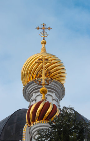 Domes of an Orthodox Christian church with gold crosses.