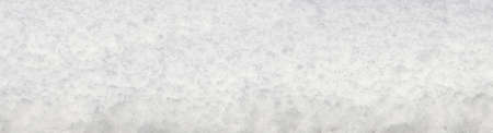 Background, fallen snow in winter. Horizontal, seasonal banner for the site.の写真素材