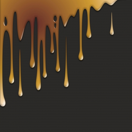 golden wall paint runs down a black surfaceの写真素材