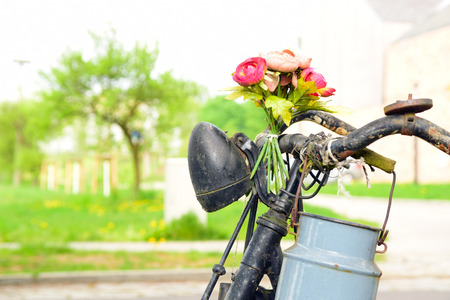 closeup of old bicycle decorated with flowersの写真素材