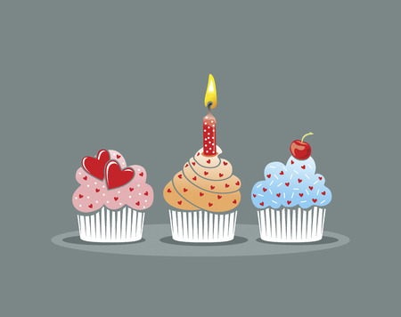 three different cupcakes decorated with candle and heartsのイラスト素材