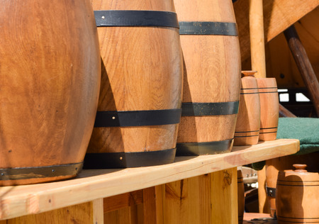 lots of different barrels on a marketの写真素材