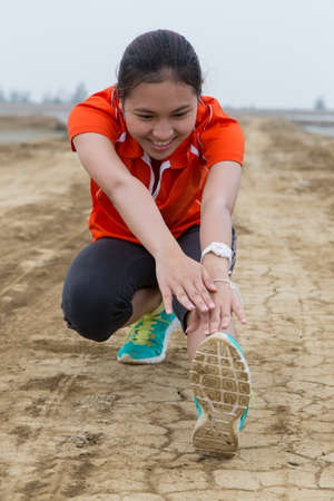 healthy young woman stretching before Fitness and Exerciseの写真素材