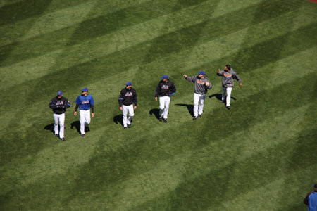 New York, April 05,2009: A group of National League Baseball players walk across the outfield on a...