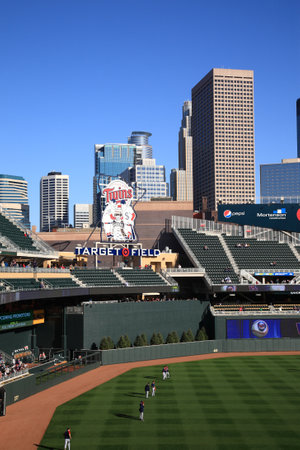 Minneapolis, April 21, 2010: Classic Minnesota Twins logo installed at new Target Field, with Minneapolis skyscrapers in background. のeditorial素材