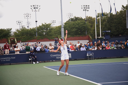 New York - September 9, 2010: Elina Svitolina of the Ukraine serves  at a U.S. Open Junior Girls Singles 3rd Round Match, but is defeated by Sloan Stephens of the USA 6-4 6-0 at the Billie Jean King Tennis Center in New York.のeditorial素材