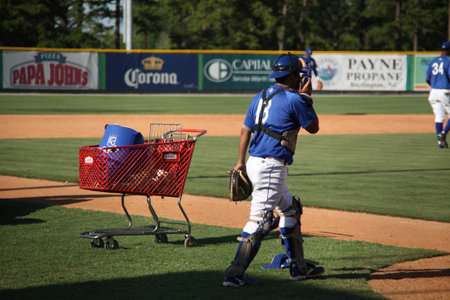 Burlington, North Carolina - June 29, 2009: Minor league baseball catcher during infield practice...