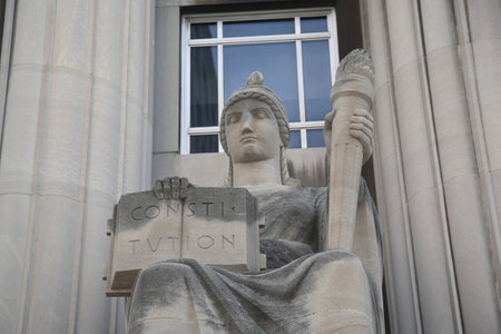 St. Louis, September 18, 2010: Mel Carnahan Courthouse. Constitution and torch statue at the former Federal Courthouse in St. Louis, Missouri. The building was constructed in 1935 with allegorical figures.のeditorial素材