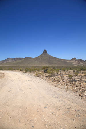 Mountain and Desert Landscape - Dirt road in the American Southwest.の写真素材