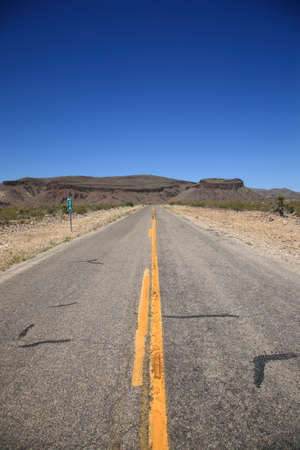 Desert Landscape - Road heads into the Black Mountains of Arizona in the American Southwest.の写真素材
