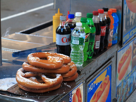 New York - March 6, 2015: A Manhattan hot dog stand featuring salty pretzels.のeditorial素材