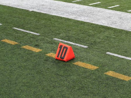 Football Field Yard Marker - Ten 10 yard line on turf playing field