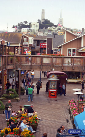 San Francisco, California - September 20, 2007: Tourists enjoy famous Fishermans Wharf.のeditorial素材