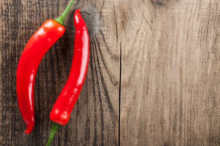 Chili on wooden background close-upの写真素材