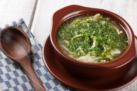 Chicken noodle soup in ceramic bowl