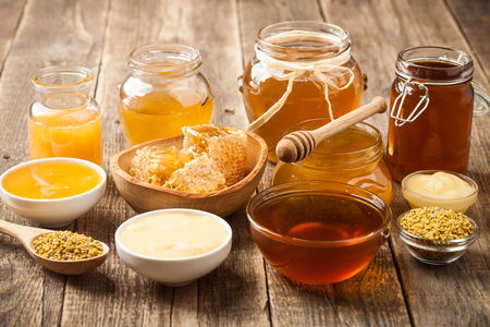 Various honey on wooden tableの写真素材