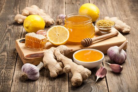 Healthy food table with honey, ginger, garlic and lemonの写真素材