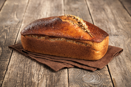 Homemade rye bread on wooden tableの写真素材