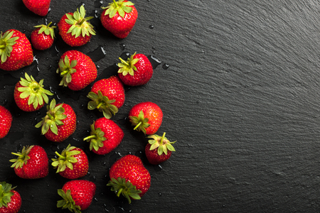 Fresh strawberries on black backgroundの写真素材