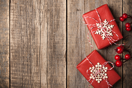 Christmas gift boxes on wooden backgroundの写真素材