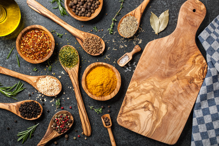 Cooking table with spices and herbsの写真素材
