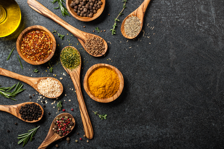 Cooking table with spices and herbsの写真素材