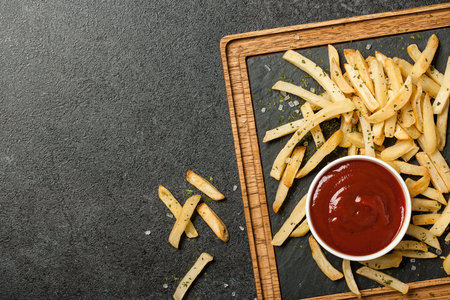 French fries with tomato sauceの写真素材