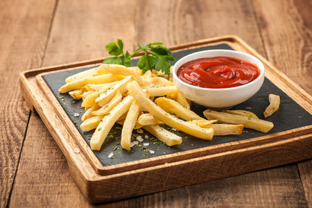 French fries with tomato sauceの写真素材