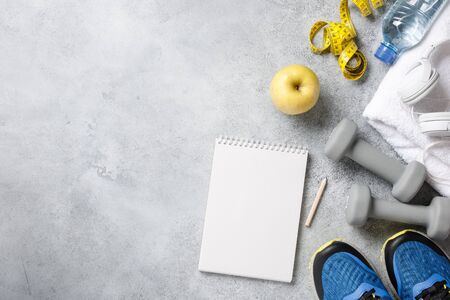 Fitness background with exercise plan notebookの写真素材