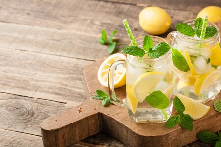 Fresh lemon drink with ice and mintの写真素材