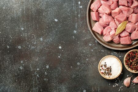 Fresh pork meat on ceramic plate for cookingの写真素材