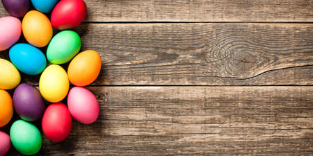 Easter eggs on wooden backgroundの写真素材