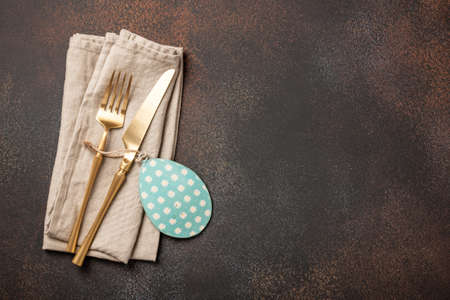 Easter setting table with cutlery and egg decorationの写真素材