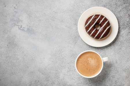 Cup of coffee and chocolate donutの写真素材