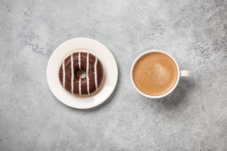 Cup of coffee and chocolate donutの写真素材